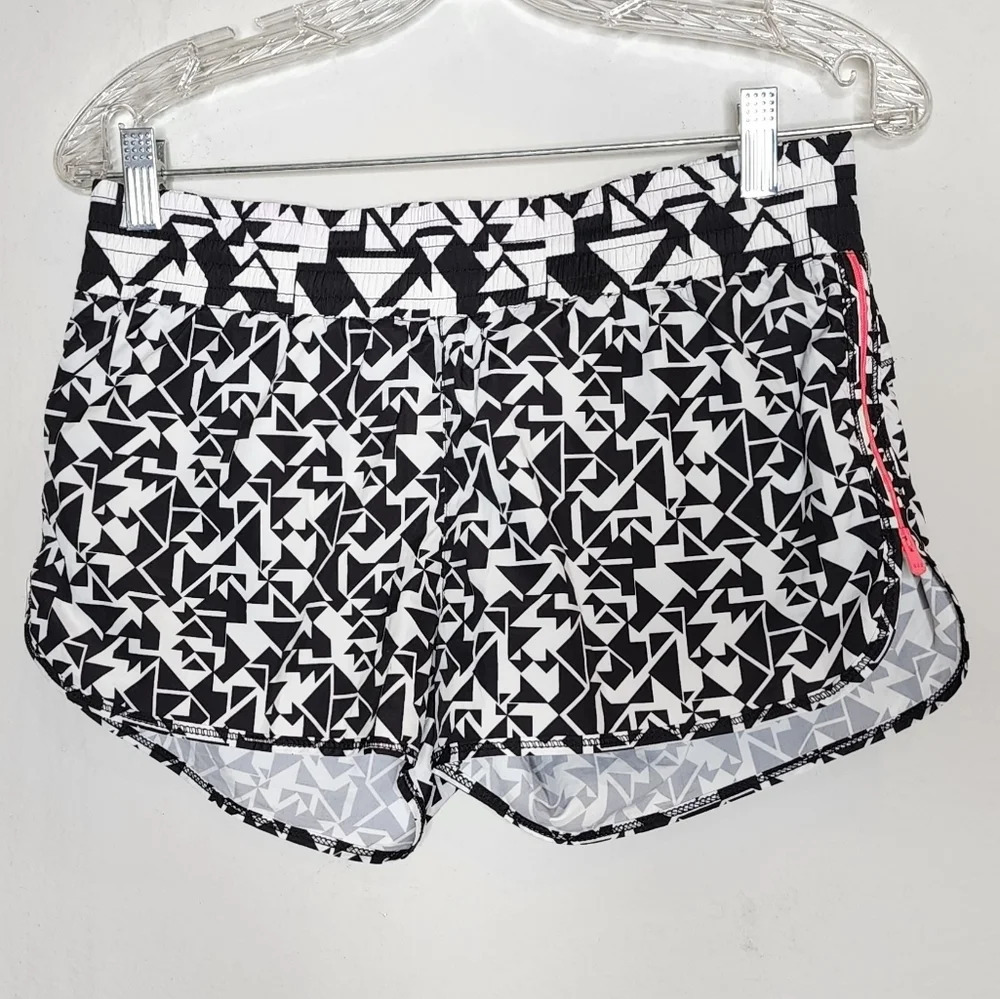 Lorna Jane running shorts. Pink side zippers. Built in shorts. Size XS.